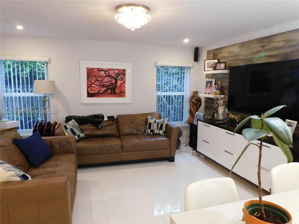 Family room easily accommodates large furnishings for endless entertaining.