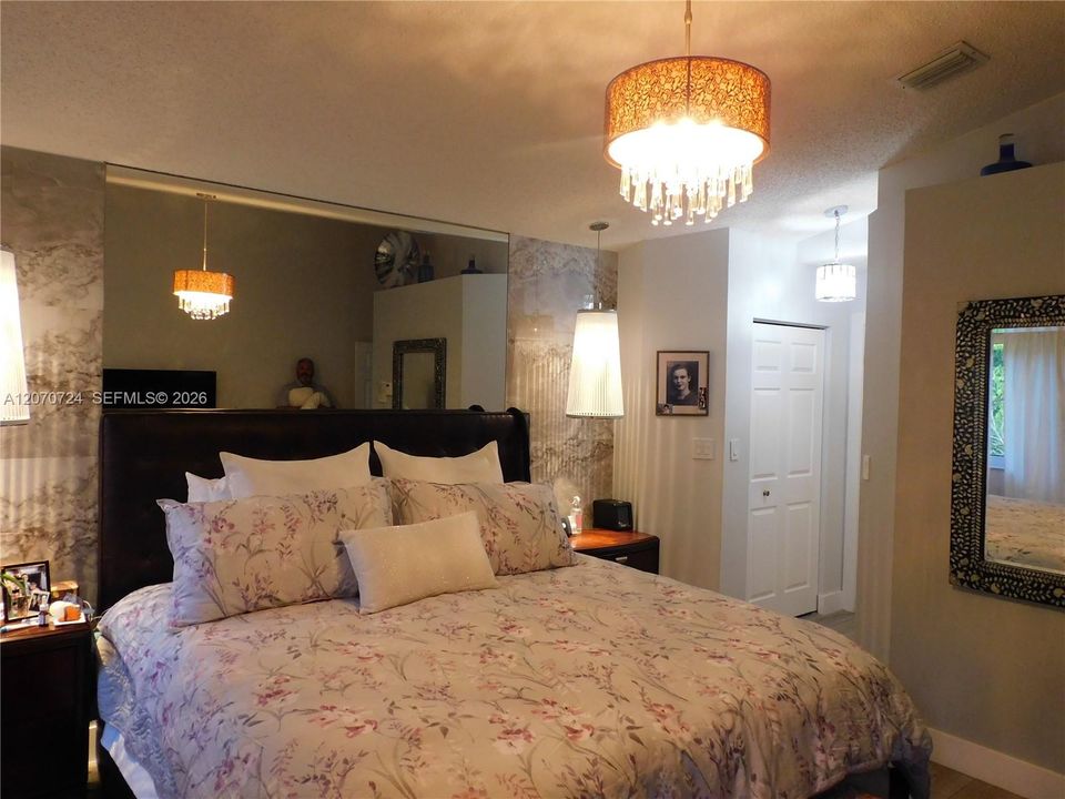 Primary Bedroom easily accommodates a King Size Bed with room to spare.