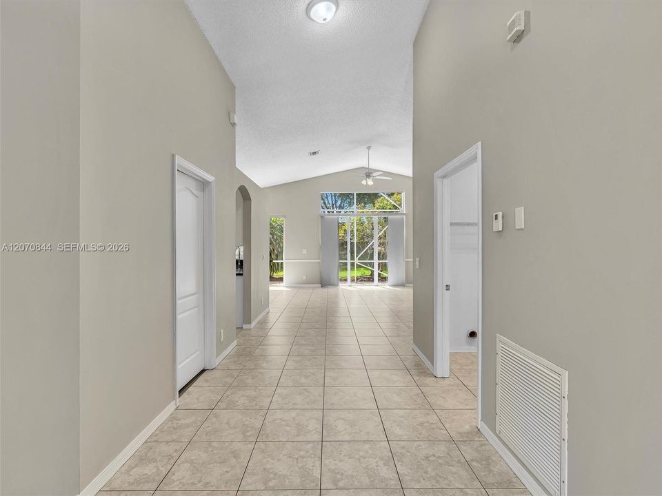 Grand entryway welcomes you into the home with a bright, open foyer that flows seamlessly into the main living space, creating an inviting first impression from the moment you walk inside.