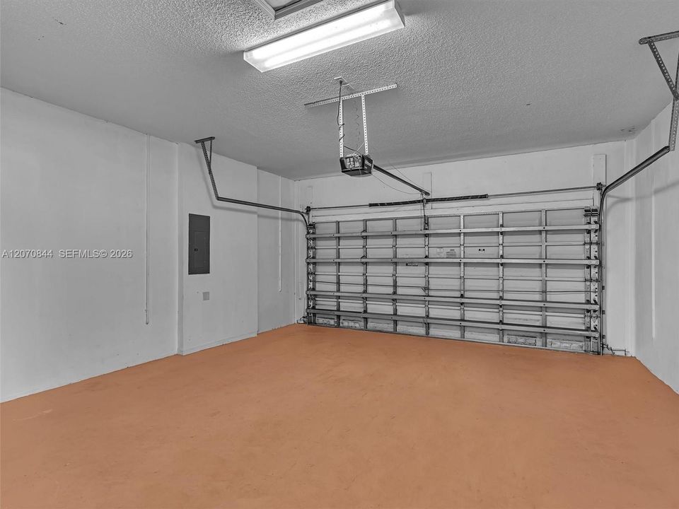 Spacious two-car garage offering ample room for vehicles, storage, and additional belongings.