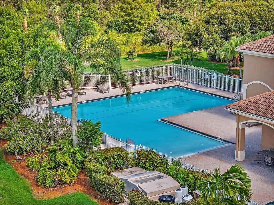 Resort-style community ammenities, including a sparkling community pool, perfect for enjoying the Florida lifestyle.