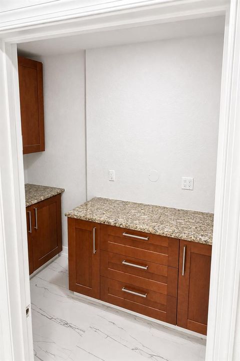 bright_white_trimmed_pantry_with_wood_ca