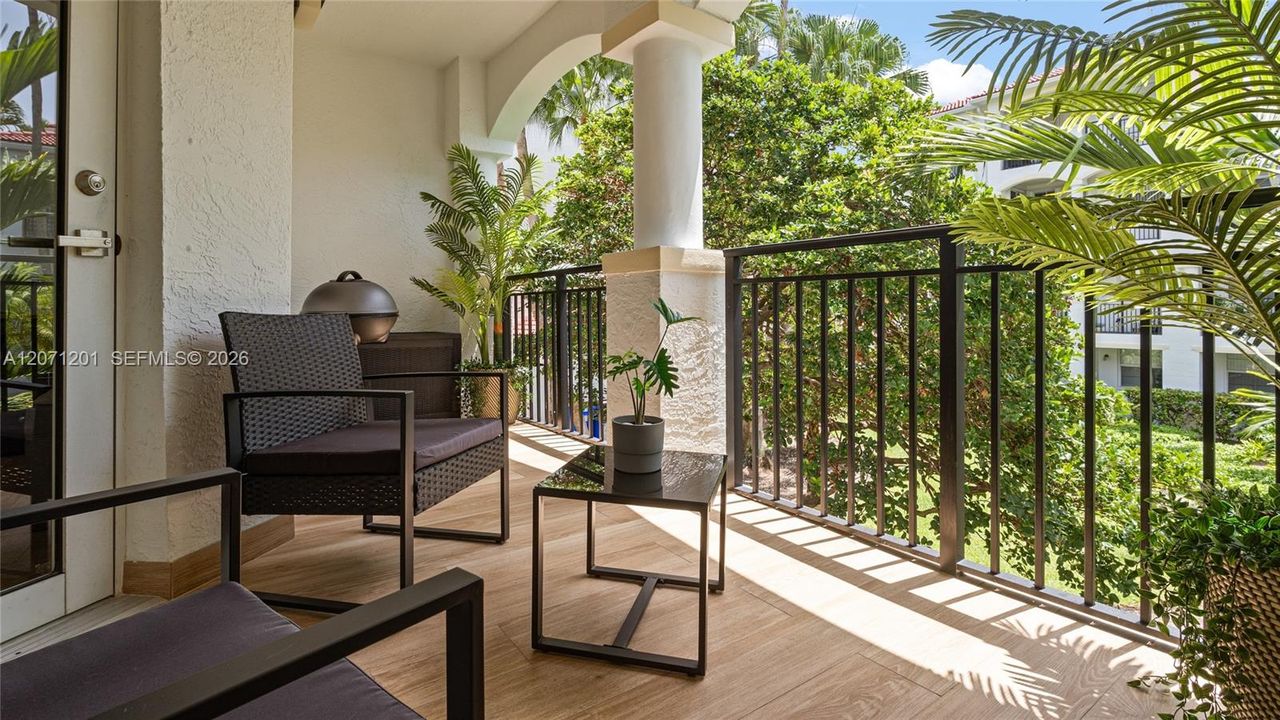 A nice patio with an electric grill.  The develoment has two set ups areas to grill.  One at the west pool, and the other on the upper deck adjacent to bldg. 13.