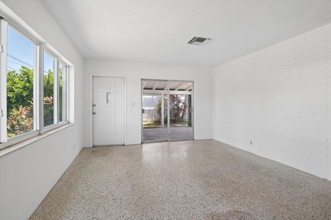 Living Room with white brick wall