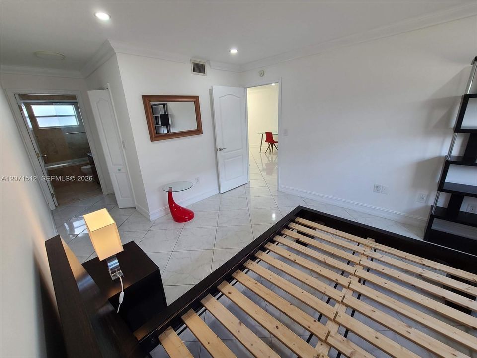 On-suite bathroom and hallway with walk-in closet