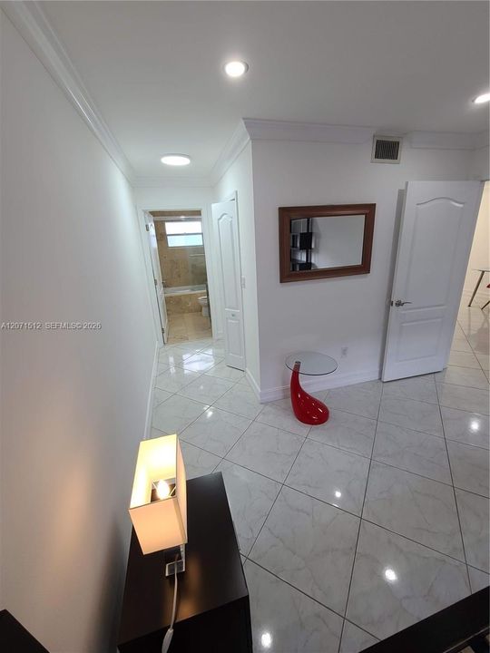 On-suite bathroom and hallway with walk-in closet