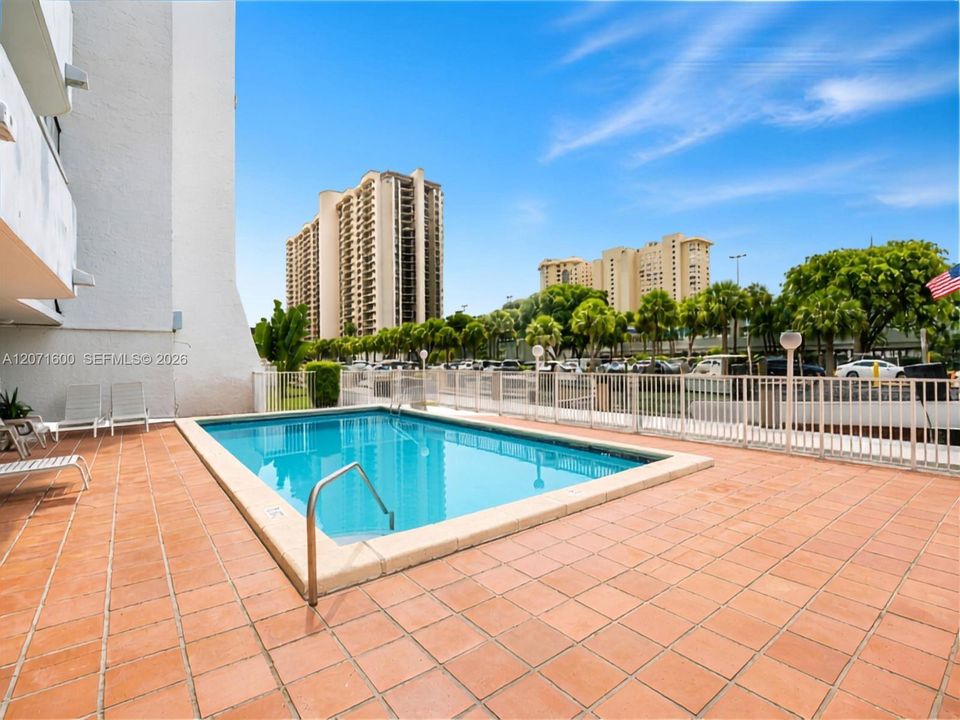 Relaxing waterfront pool deck situated right along the canal with scenic water views.