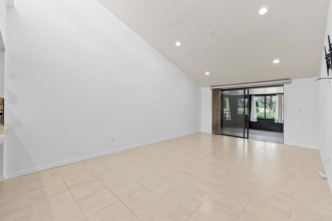 Living room with doors to bonus room