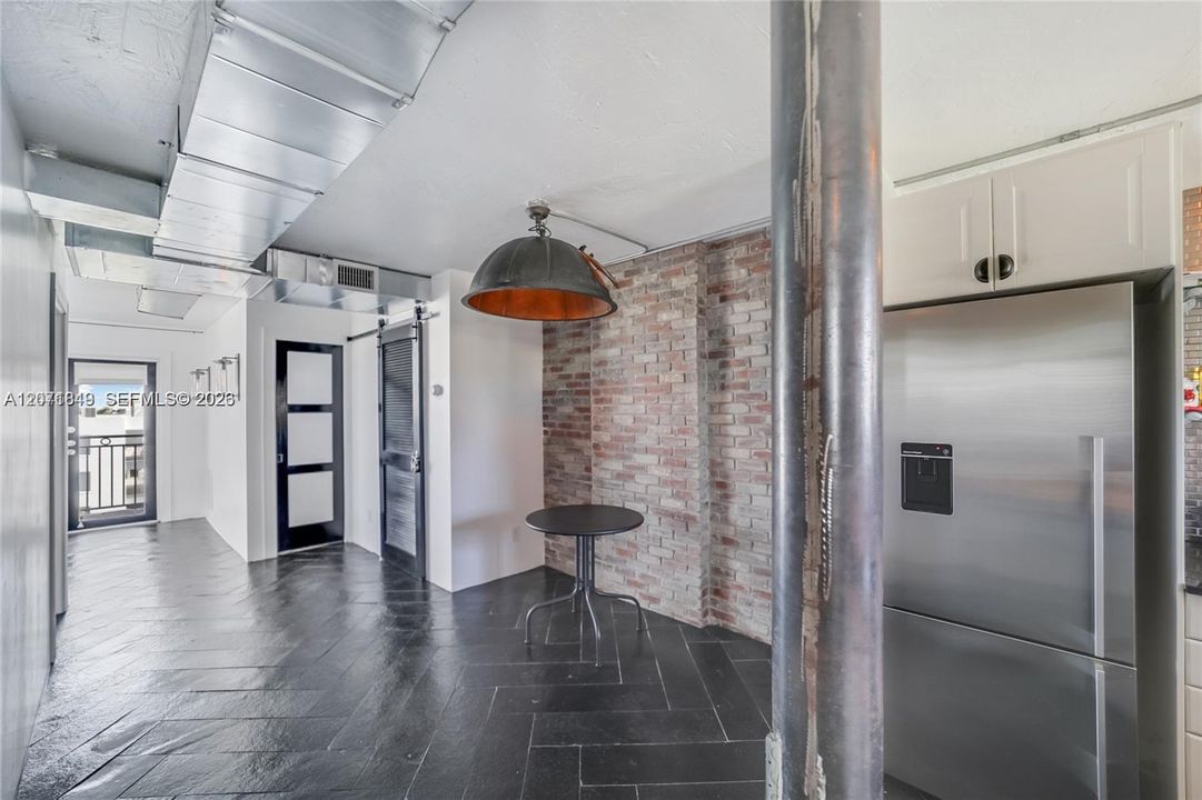 From kitchen back to dining area and living room