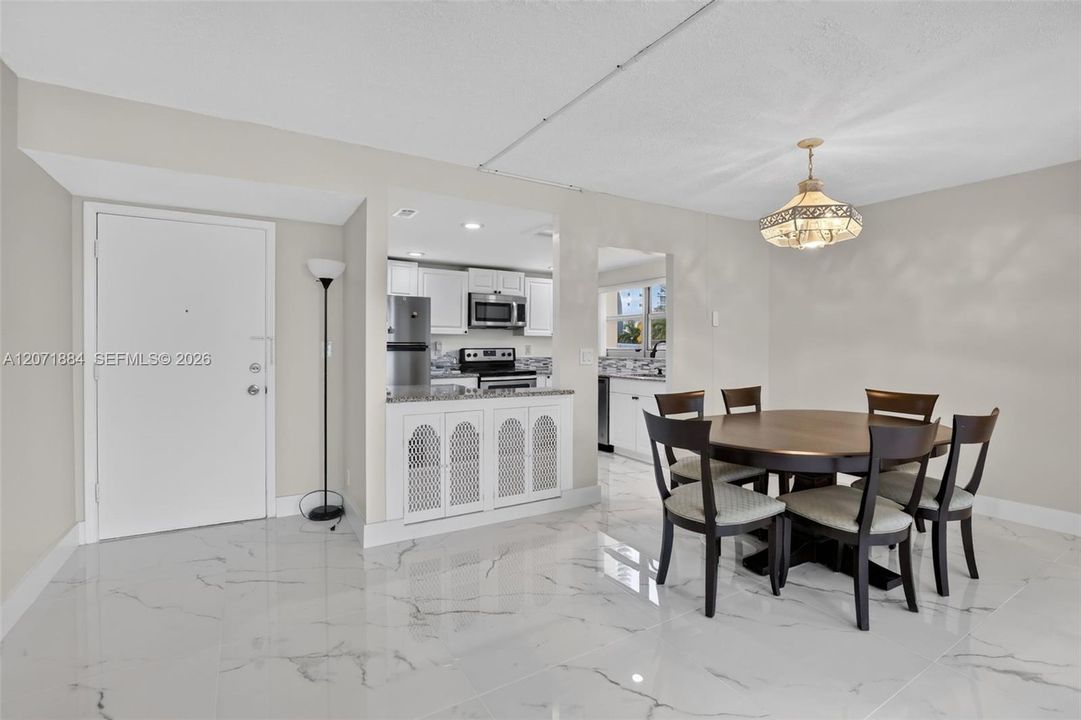 MAIN ENTRANCE DINING/LIVINGROOM AREA
