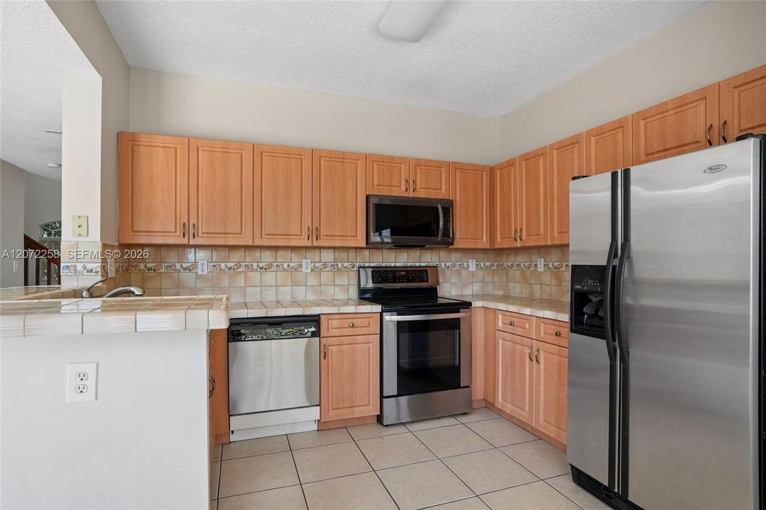 WITH ALL STAINLESS STEEL APPLIANCES