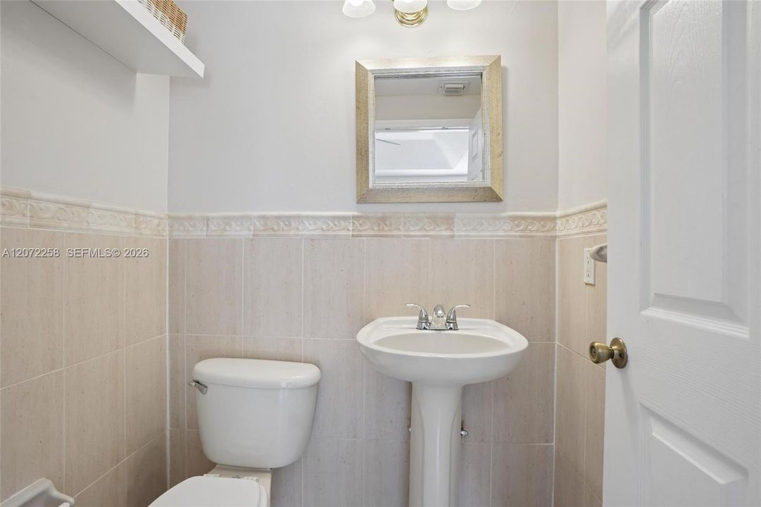 1/2 BATH IN FAMILY ROOM - 1ST FLOOR