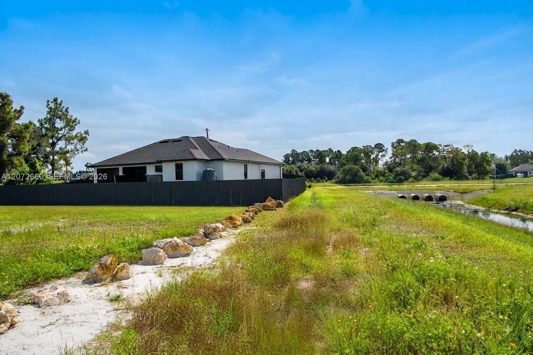 Rear view fully fenced for max privacy, canal view, corner unit max privacy