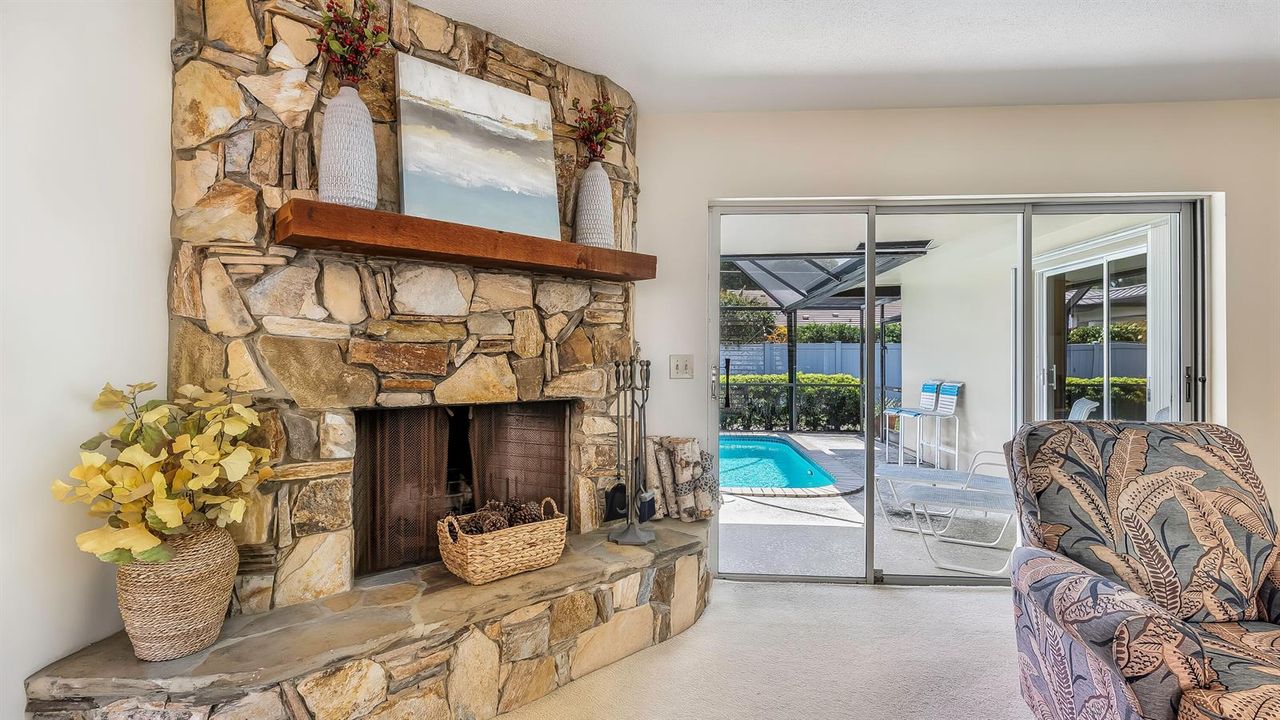 LIVING ROOM & WOOD BURNING FIRE PLACE