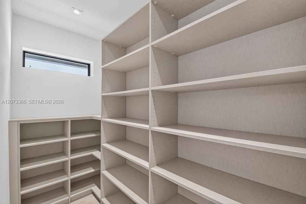 Custom Hideaway pantry shelving