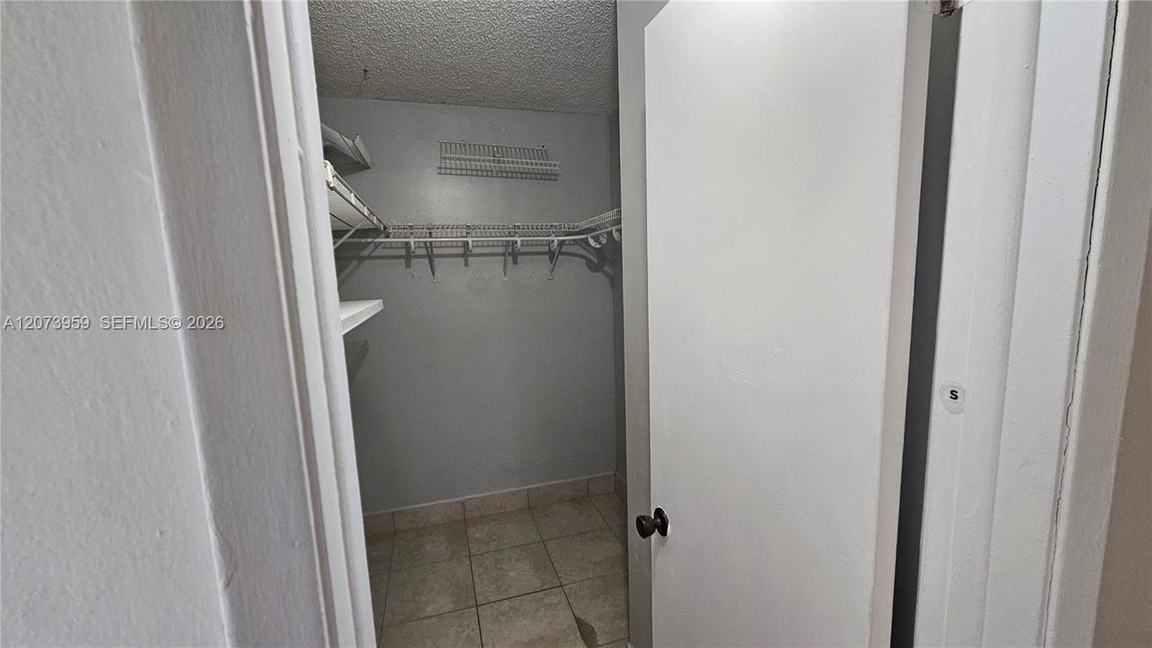Primary bedroom walking closet