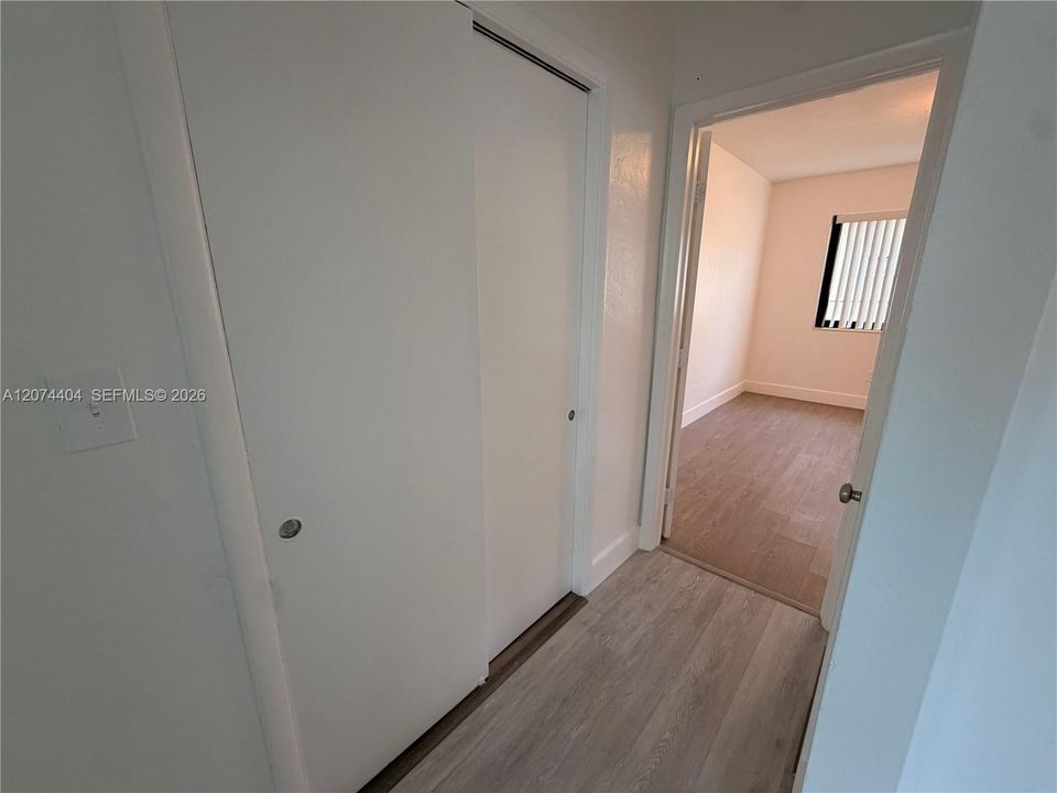 Hallway with 2 big closets on each side