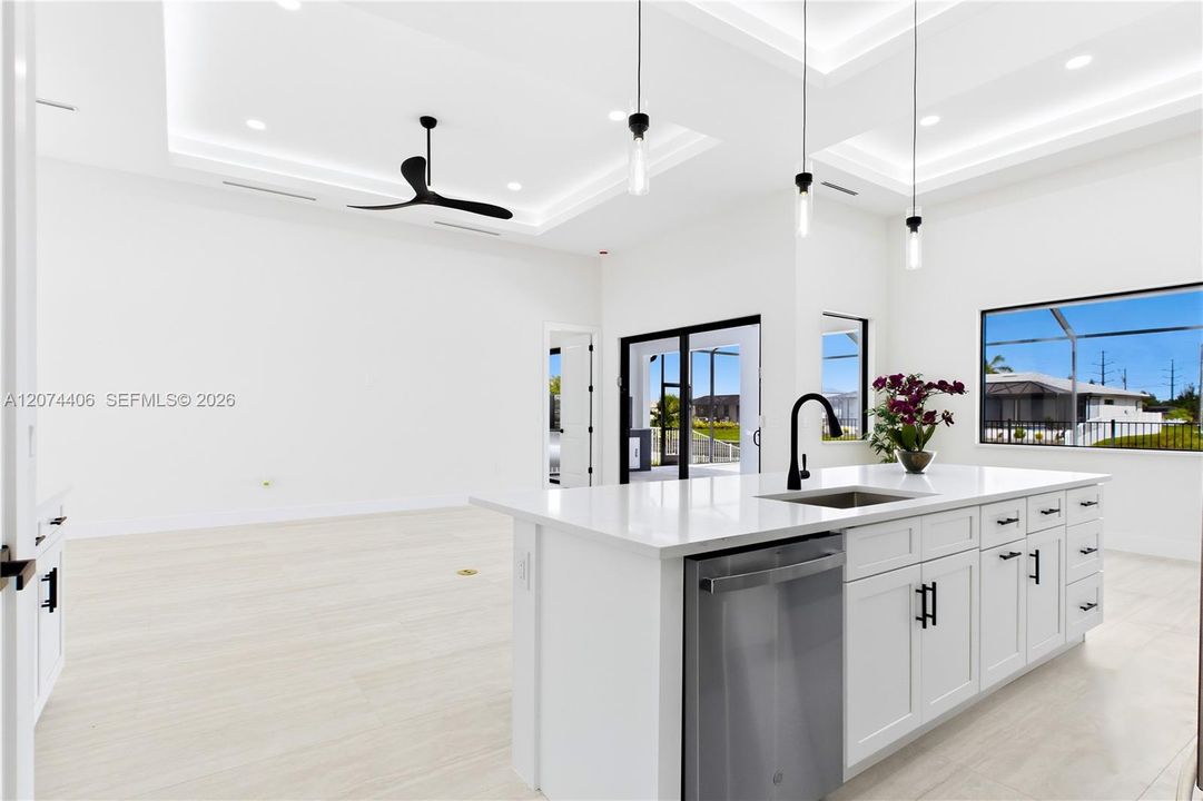 Oversized WATERFALL ISLAND w/ striking vertical WOOD SLAT DETAILING & abundant storage.