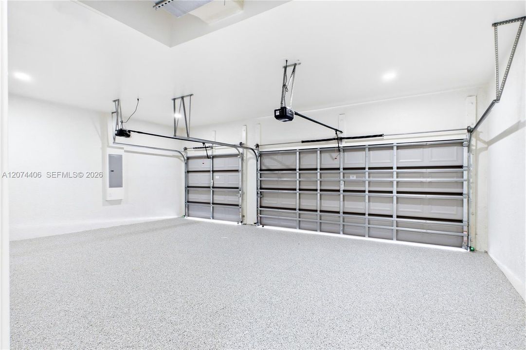SPACIOUS 3-CAR GARAGE w/ durable EPOXY FLOORING offers plenty of room for vehicles, storage, bikes, water toys & all your SWFL LIFESTYLE essentials!