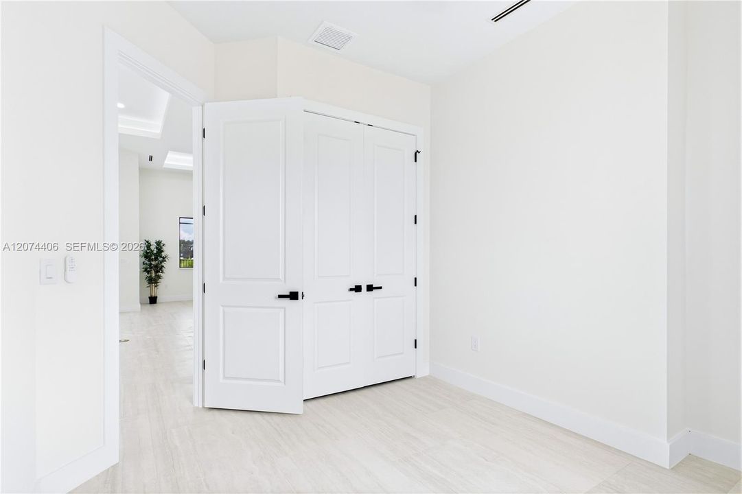 VERSATILE FOURTH BEDROOM offers the flexibility to fit your lifestyle; ideal as a private HOME OFFICE, DEN, STUDY, guest room or creative space.