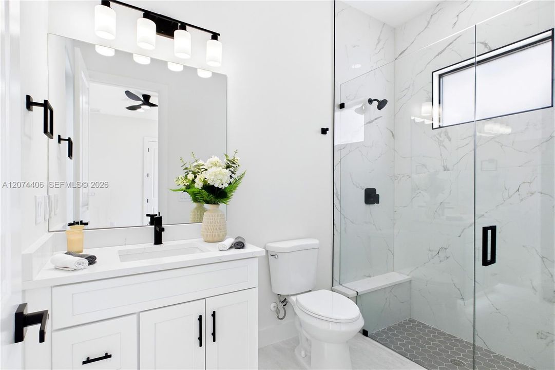 Convenient POOL BATH ACCESS makes indoor-outdoor living effortless for guests & poolside days!