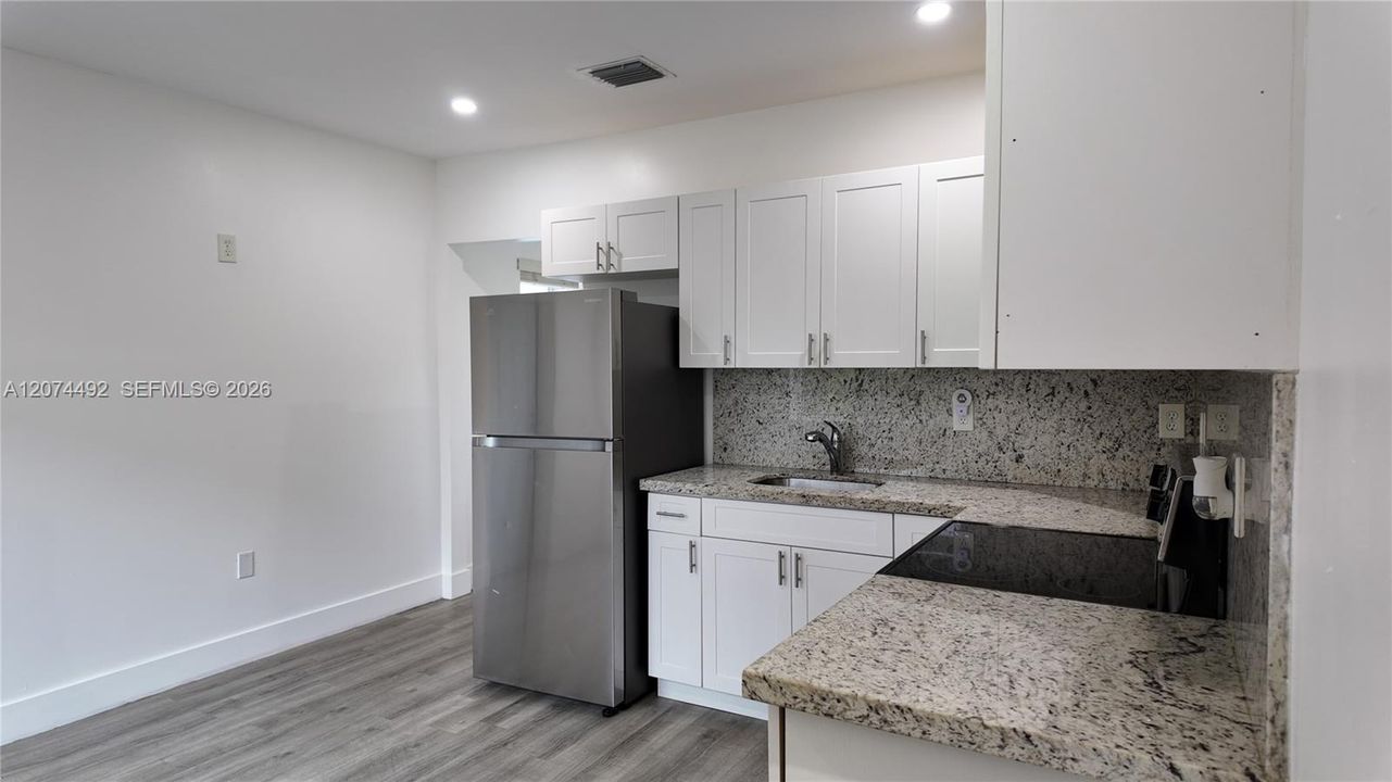 There’s plenty of cabinet storage and counter space for everyday cooking without overwhelming the room.