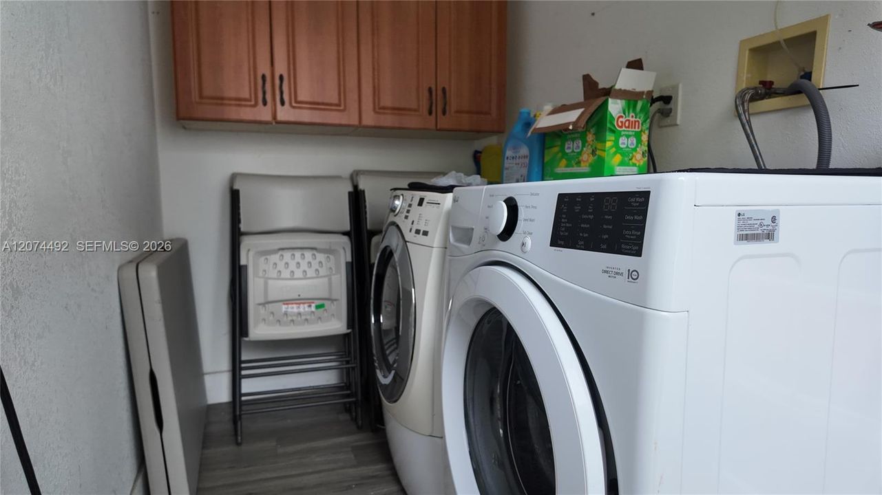 dedicated laundry area with washer and dryer.