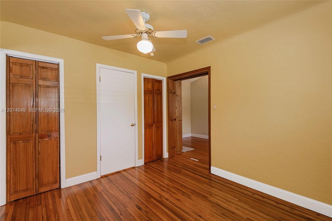 The open door is from the Den into this 2nd bedroom.