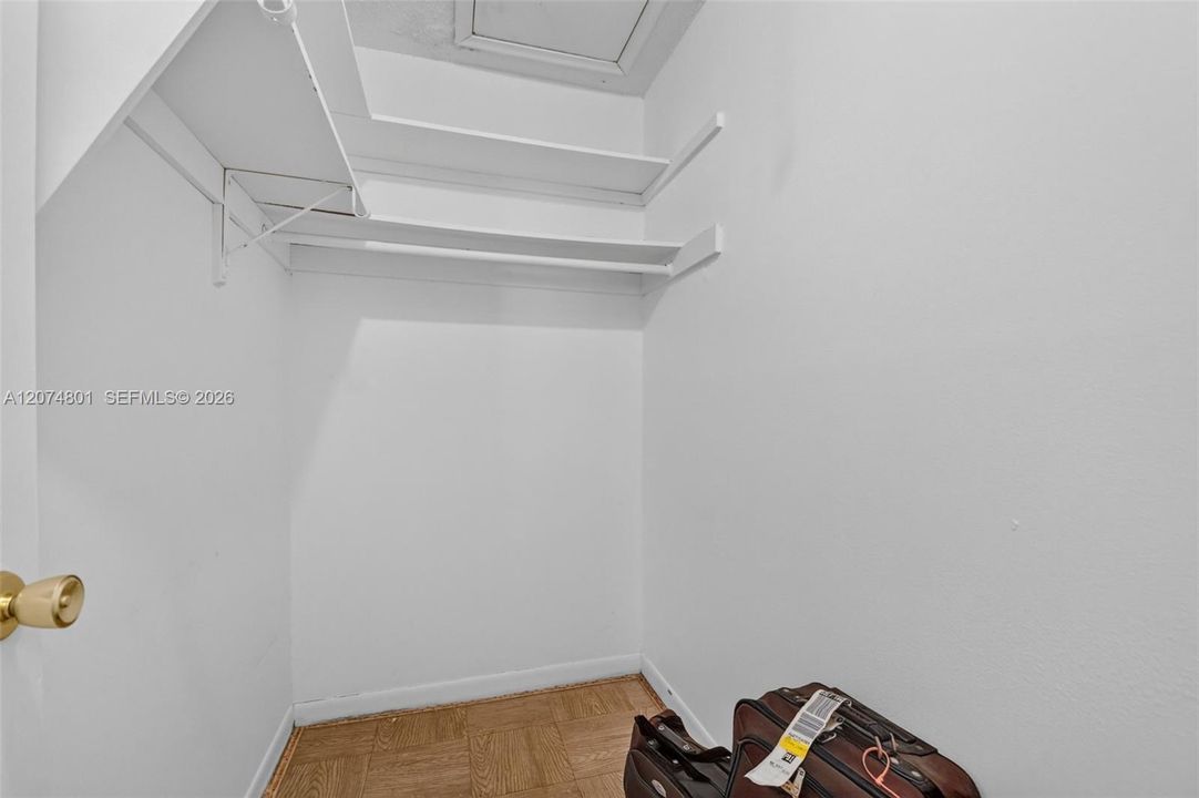 1 of 2 walk-in closets with attic access