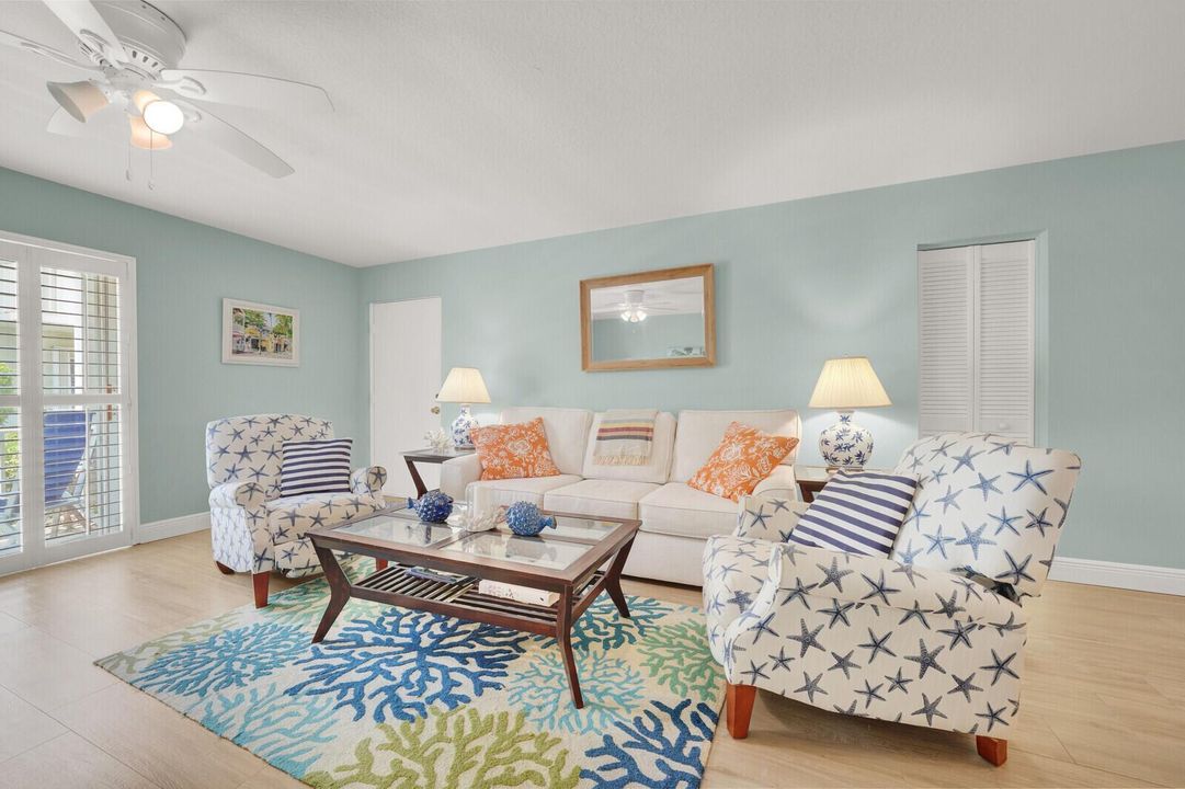 Coastal Living room w/acess to patio