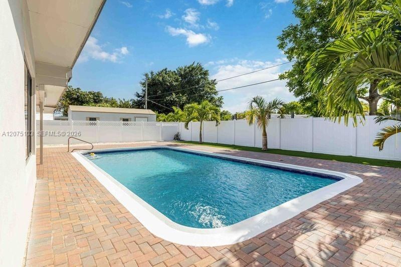 Fenced in back yard with your very own Sylvester and Pineapple Date Palm trees