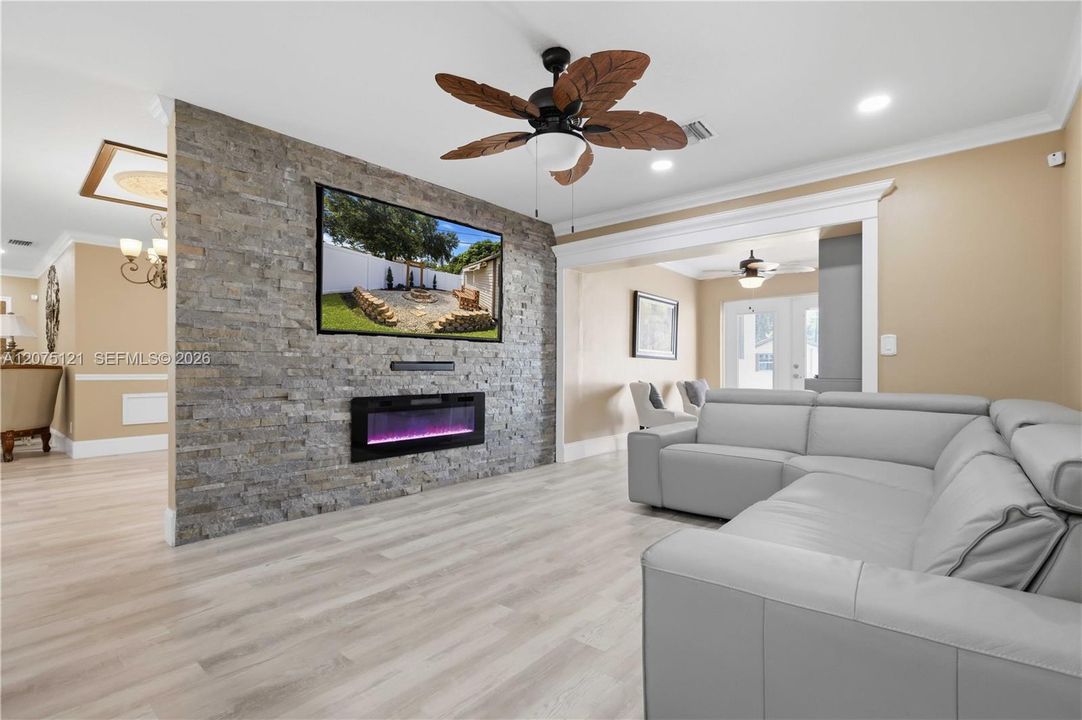 Huge TV, soundbar and electric fireplace