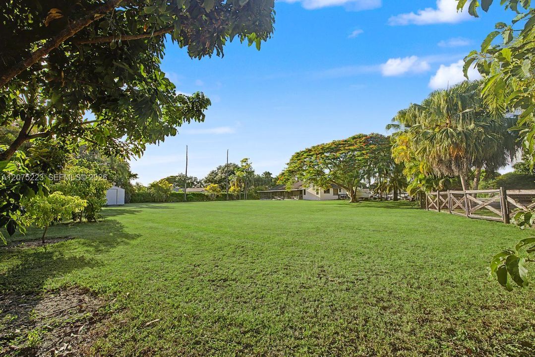 Expansive backyard offers a blank canvas to create your dream outdoor oasis, with plenty of room to envision a pool, outdoor kitchen, entertaining areas, gardens and more.