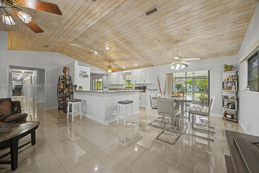 Open layout connects the living area to the kitchen and breakfast bar, ideal for everyday living and entertaining.