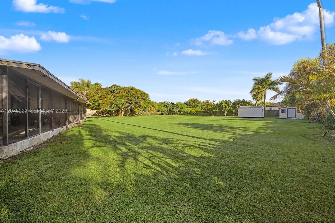 Huge, beautifully maintained backyard offers an incredible amount of open green space with room to create your own outdoor retreat.