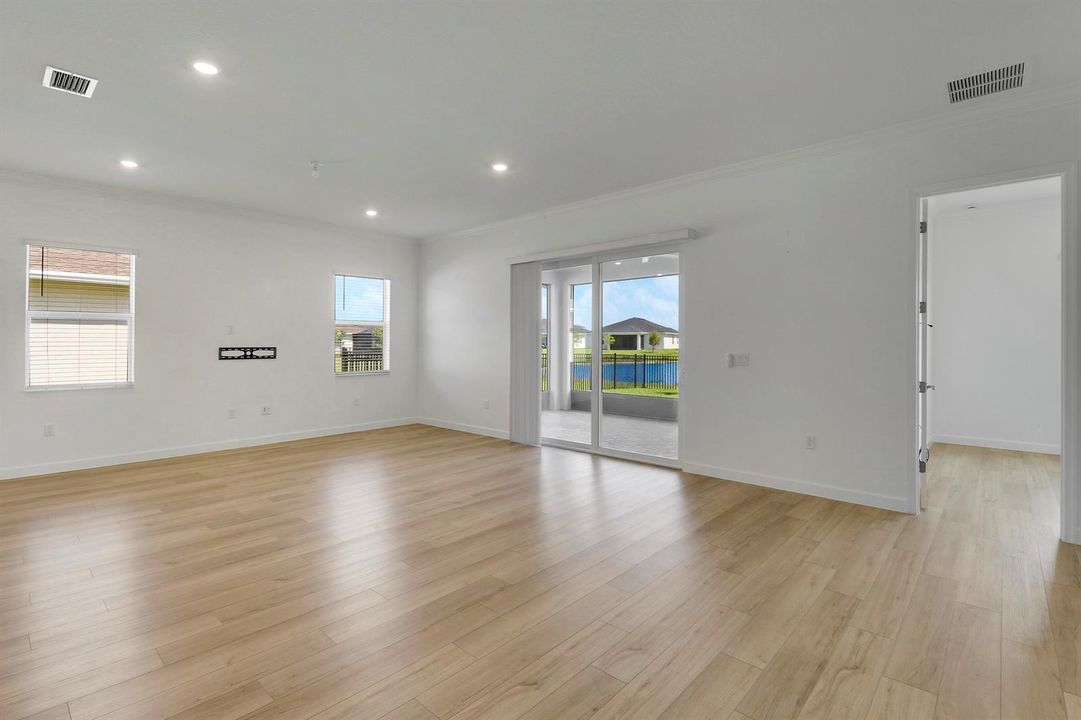Great room angle w/ kitchen in bkgd