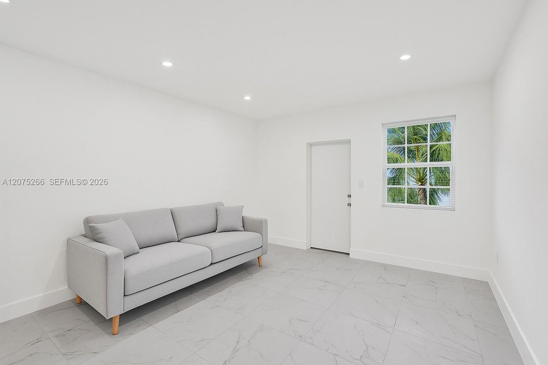 The unit is UNFURNISHED- This photo is VIRTUAL STAGED FOR VISUALIZATION