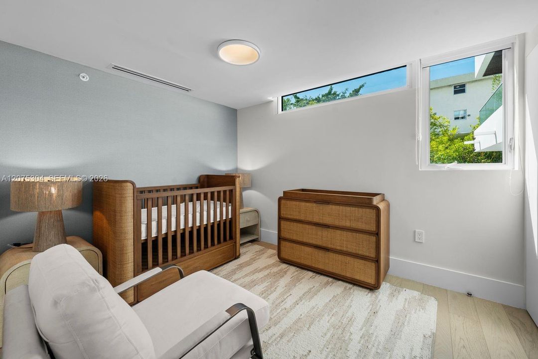Cozy third bedroom with garden views — flexible space for guests or home office.