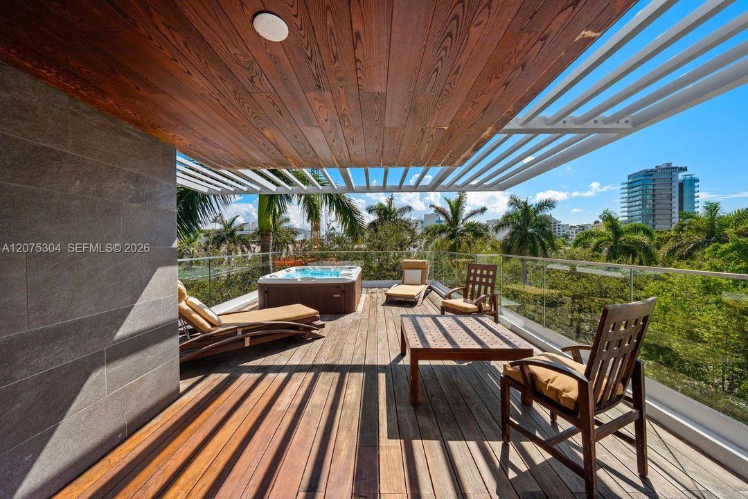 Modern private deck surrounded by lush greenery — perfect Miami Beach outdoor living for entertaining and relaxing under tropical skies.