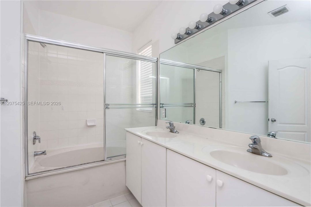 Modern secondary bathroom interior with clean finishes.