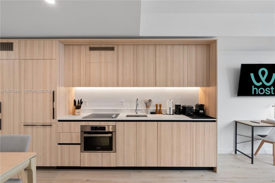 fully equipped kitchen including dishes and silverware