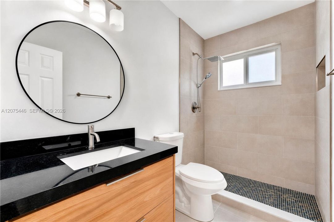 Updated bathroom with walk-in shower.
