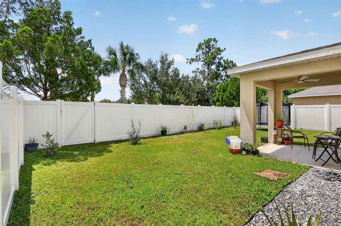 Large yard w/PVC fence