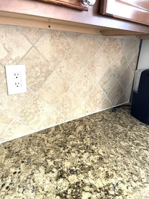 Timbled marble backsplash and granite co