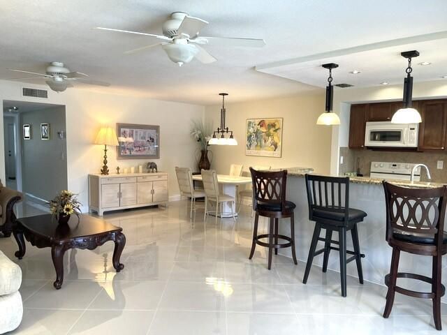 Open concept kitchen and dining area vie