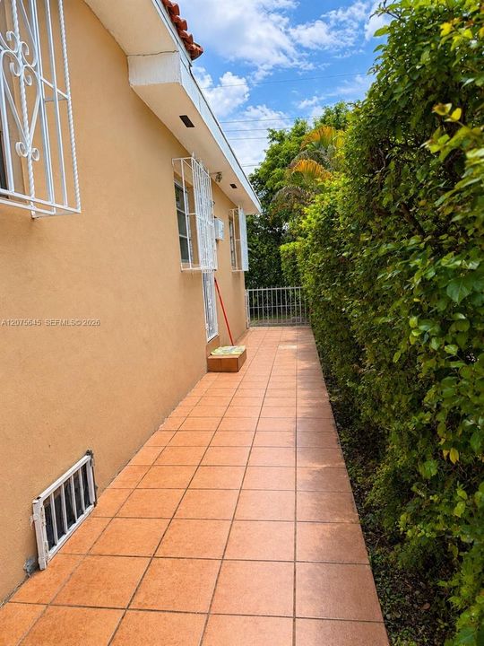 Private and fenced entrance on the right side of the house.