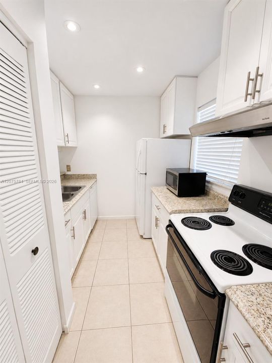 Bright Kitchen with ample Cabinet Space