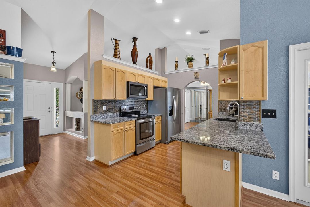 Kitchen with Front Door in Backgrouond