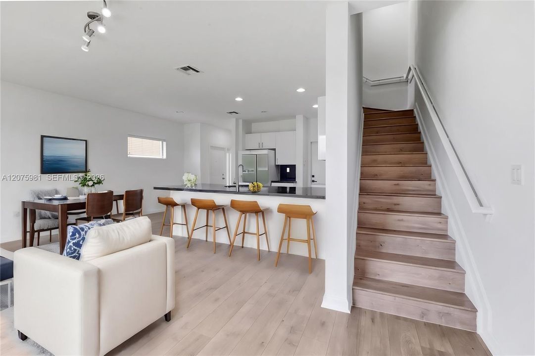 Living room and dining area / Virtually Staged