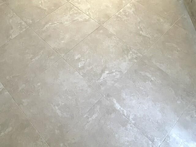 Neutral tile flooring on the diagonal th